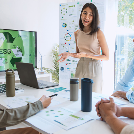 Four people in a meeting room